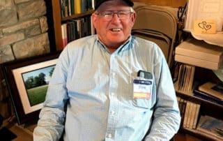 Happy Man Sitting In Historic Property