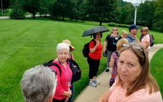 Group Of Visitors At A Church History Tour