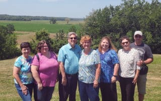 Happy Visitors At A Church History Tour