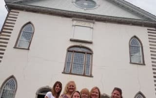 Group Of Visitors Posing In front Of Kirtland Temple